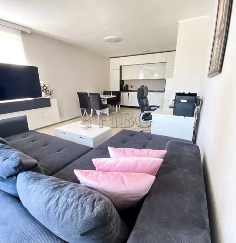 Spacious 2-bedroom apartment featuring a pool view, open-plan living area, and contemporary furnishi.