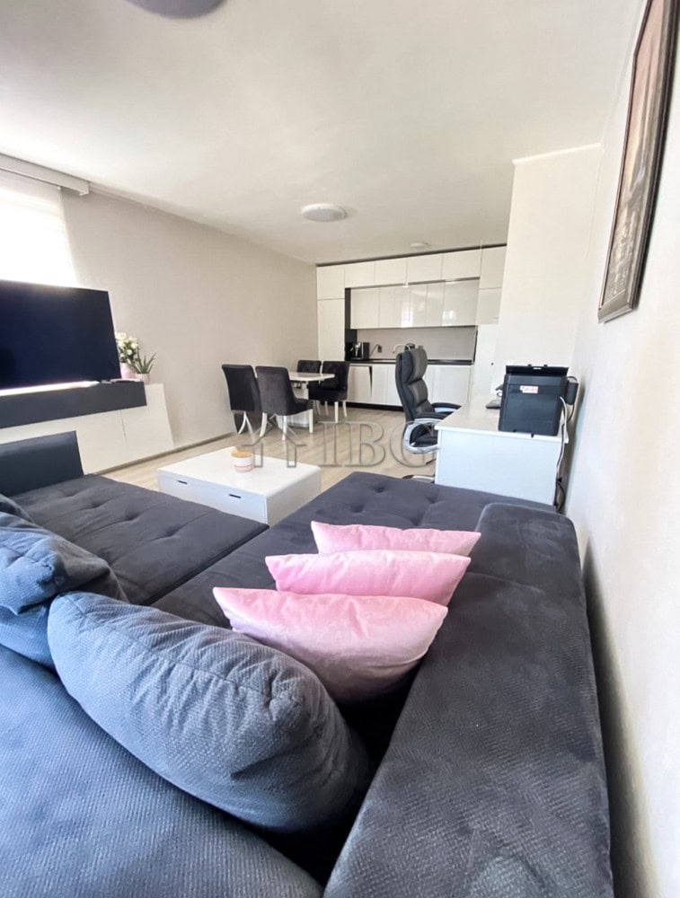 Spacious 2-bedroom apartment featuring a pool view, open-plan living area, and contemporary furnishi.