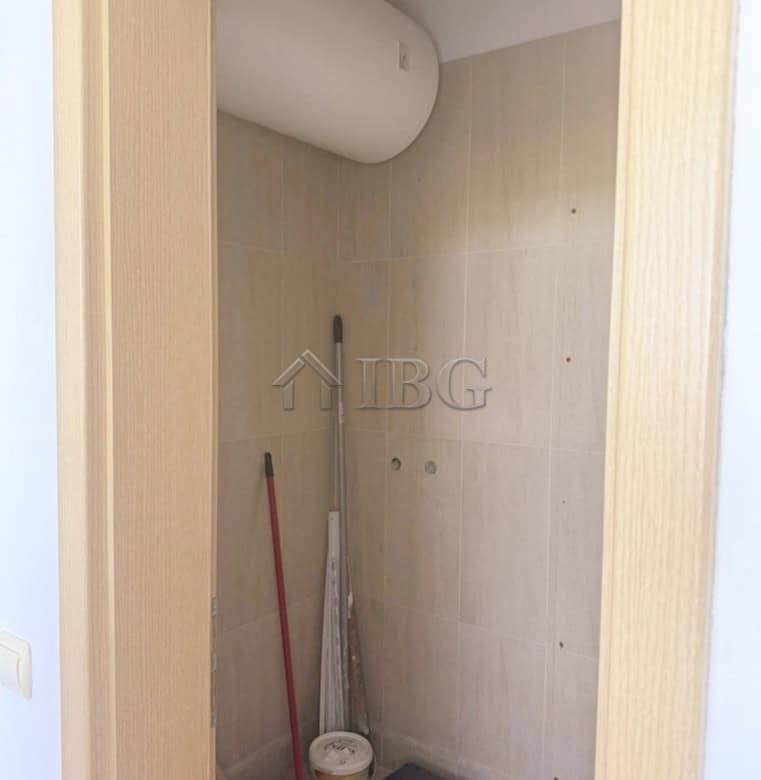 Interior view of a modern 2-bedroom apartment with golf course scenery.