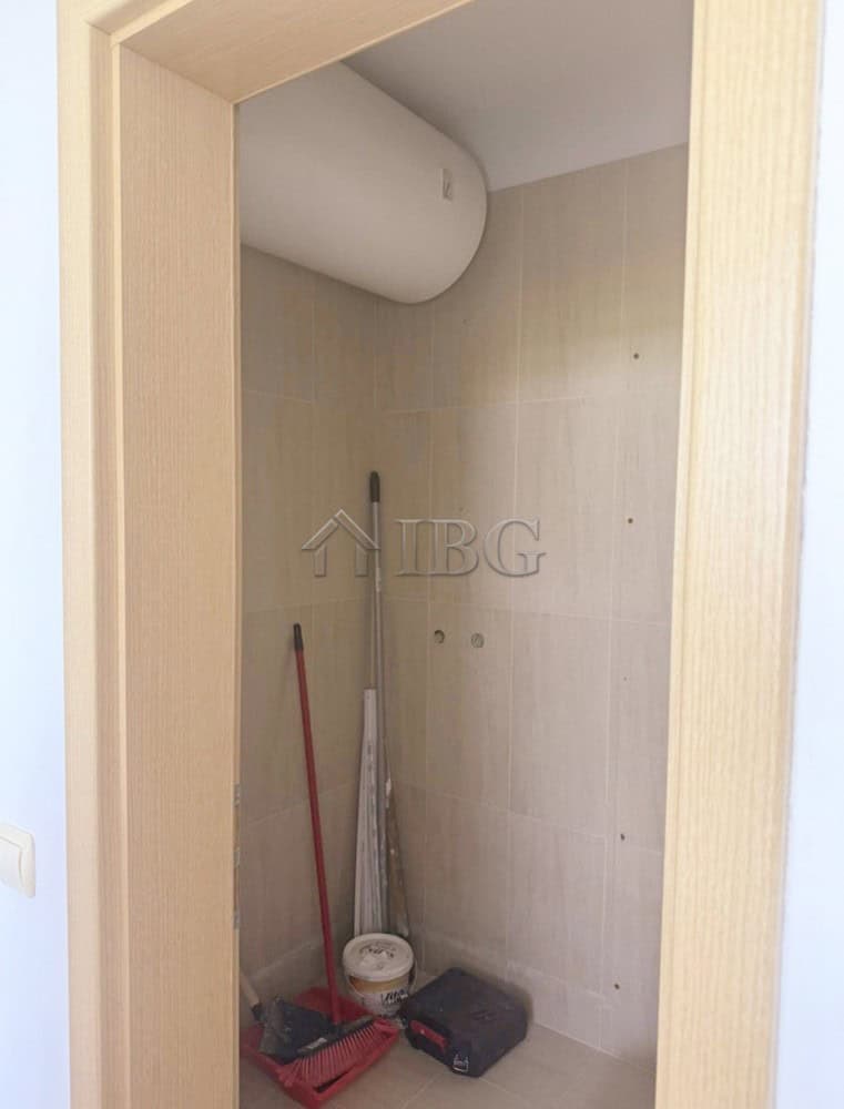 Interior view of a modern 2-bedroom apartment with golf course scenery.