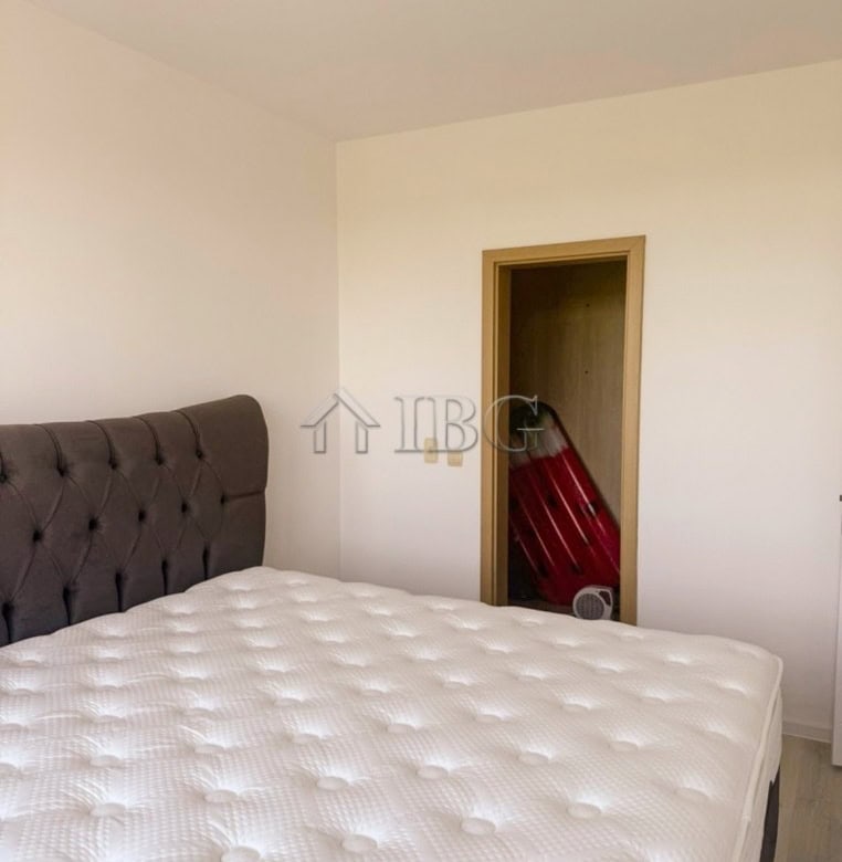 Comfortable bedroom featuring a large bed and minimalist design, perfect for relaxing stays.