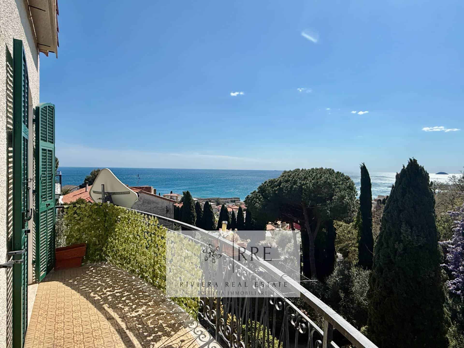Seaside property offering stunning ocean views, lush greenery, and a spacious balcony perfect for re.