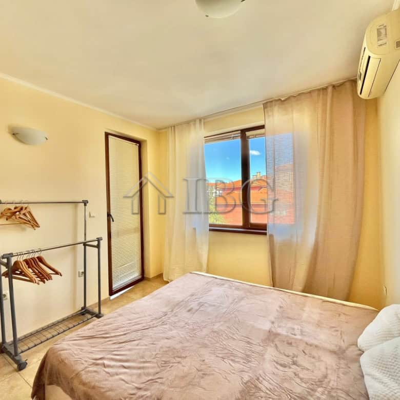 Bright bedroom with large window and air conditioning in Apollon 4, Ravda.