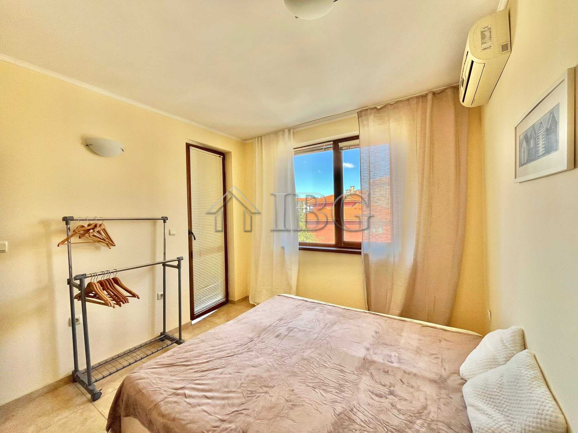 Bright bedroom with large window and air conditioning in Apollon 4, Ravda.