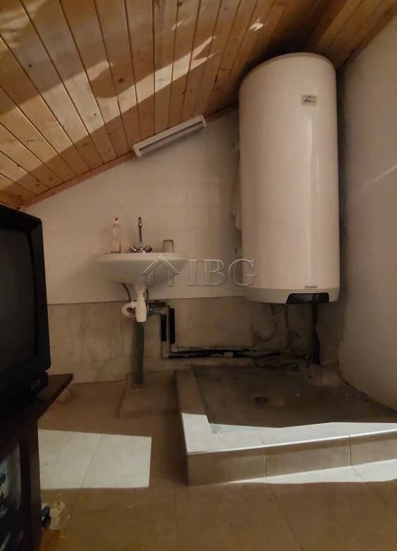 Utility room with water heater and sink in a family house in Burgas.