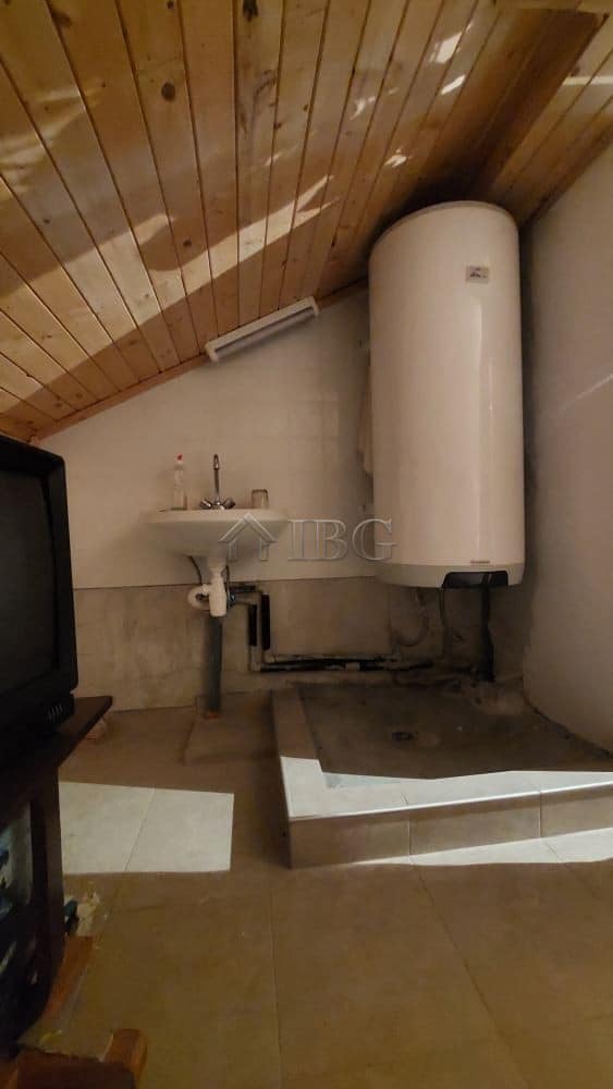 Utility room with water heater and sink in a family house in Burgas.