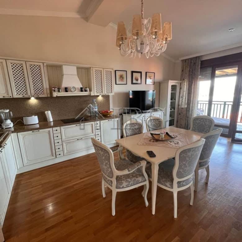 Sea view two-bedroom apartment in Santa Marina, Sozopol with modern kitchen and elegant dining area.