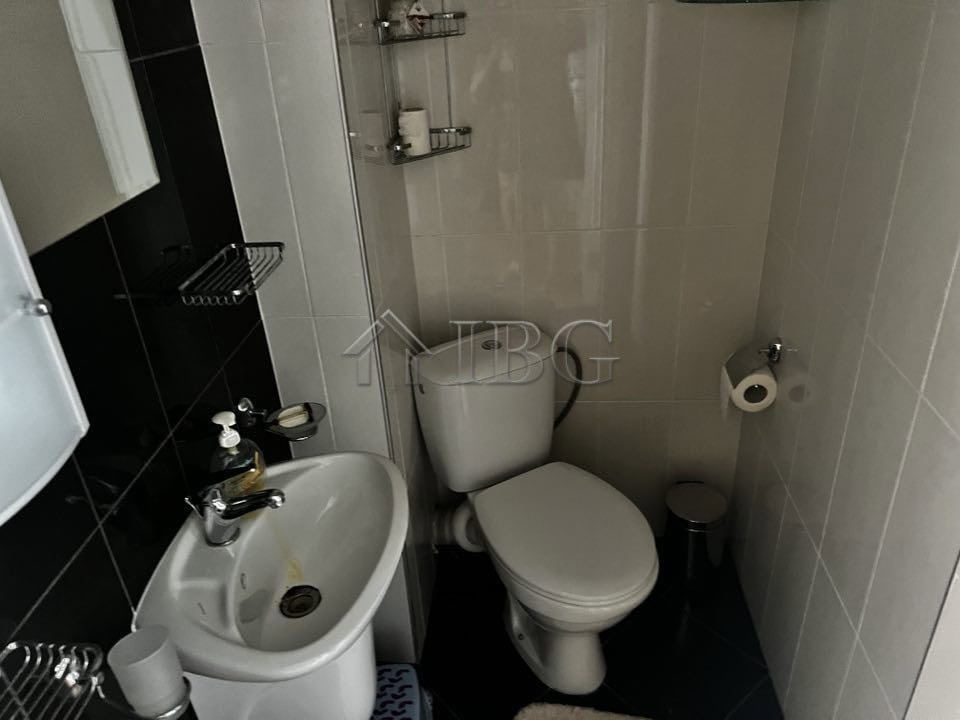 Compact bathroom featuring a sink, toilet, and shower in Sveti Vlas property.