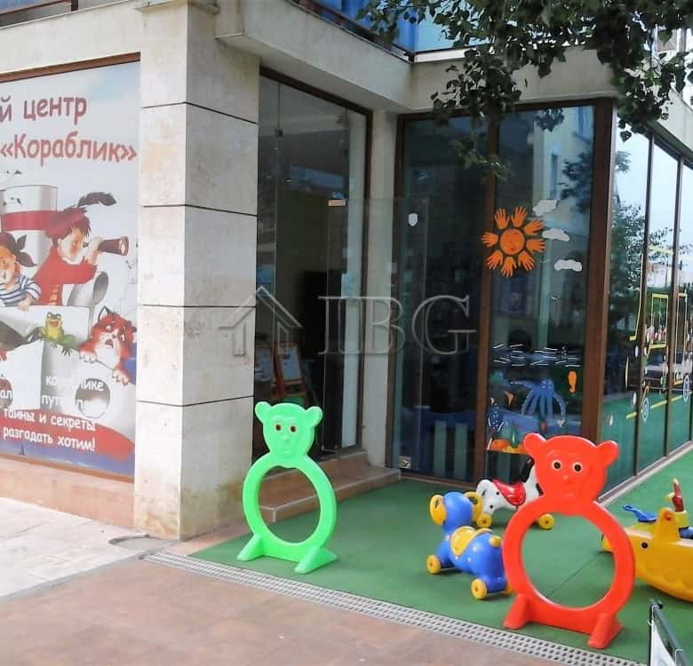 Playground with colorful bear-shaped and animal-themed ride-on toys for kids.