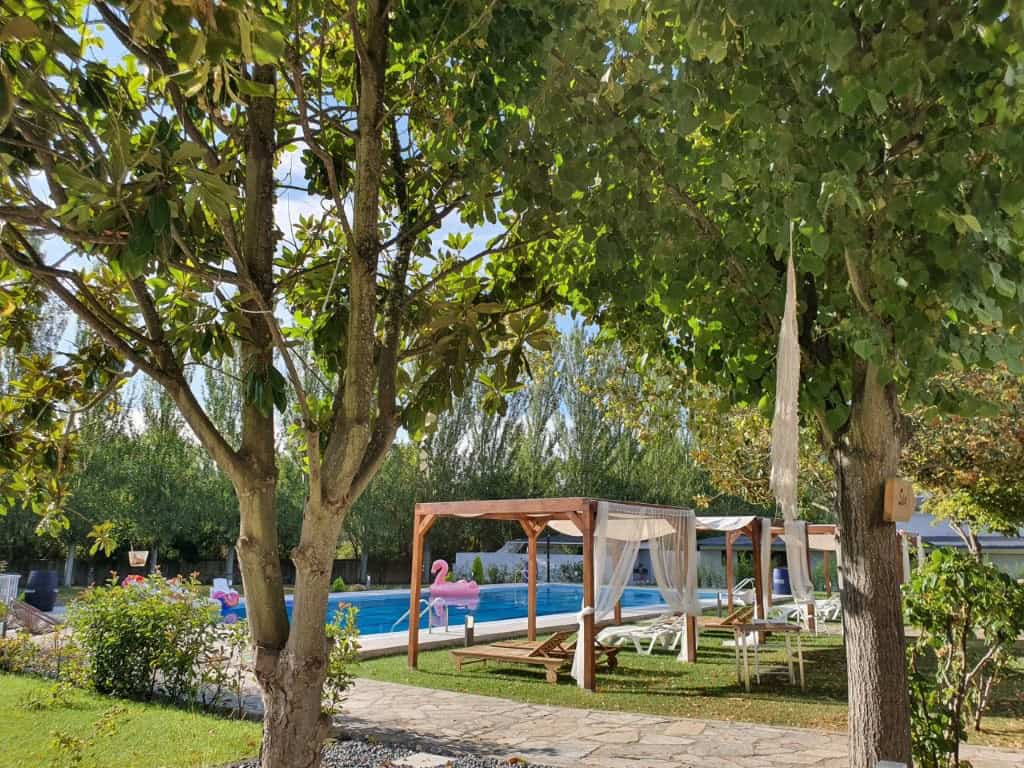 Luxury Finca Vivaldi Hotel Exterior in Leon Spain Beautiful outdoor view of a luxury finca with pool and shaded lounging area in Leon, Spain.