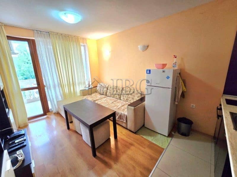 Bright apartment with pool view, living area, and kitchenette in Sunny Beach. Perfect for a comforta.