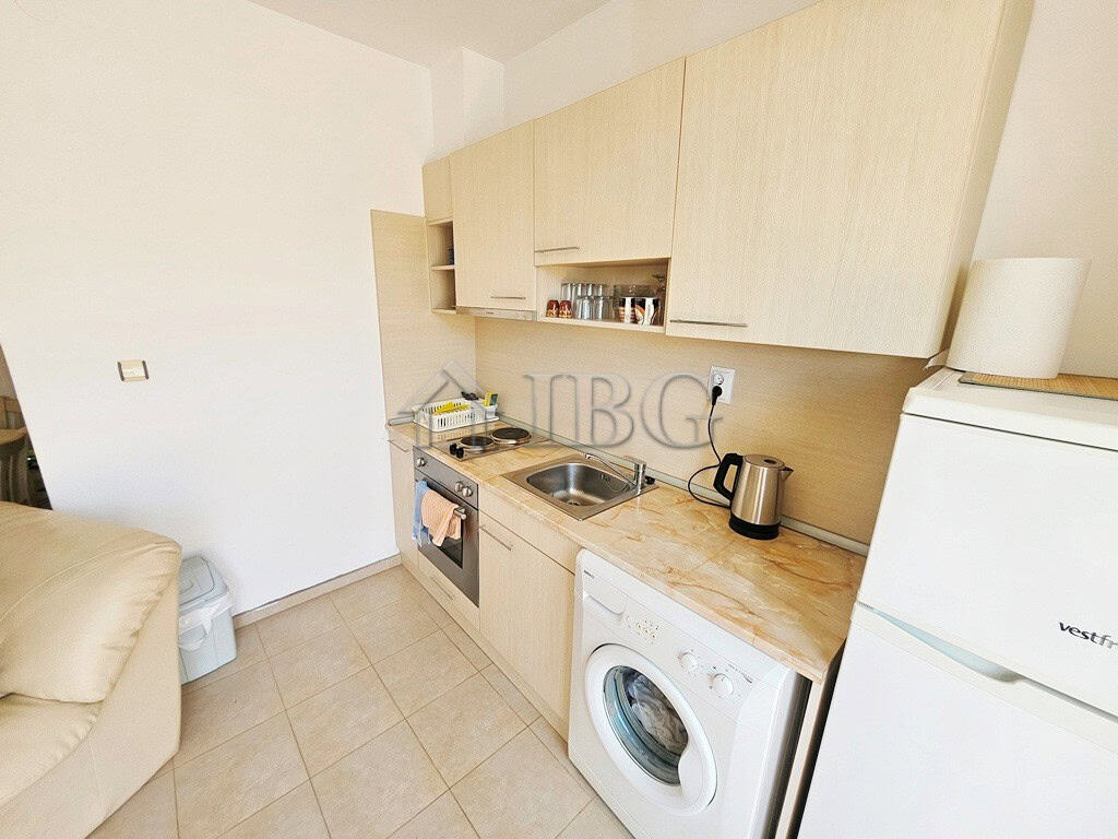 Bright kitchen with modern appliances in Sunny Beach apartment.