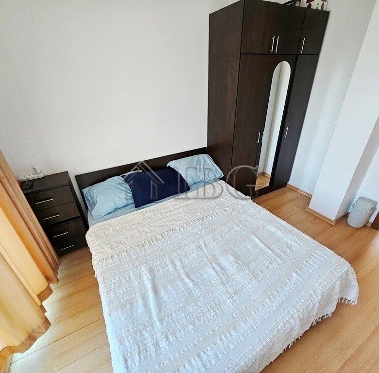 Bright bedroom with double bed and wardrobe in Sunny Day 3 complex.