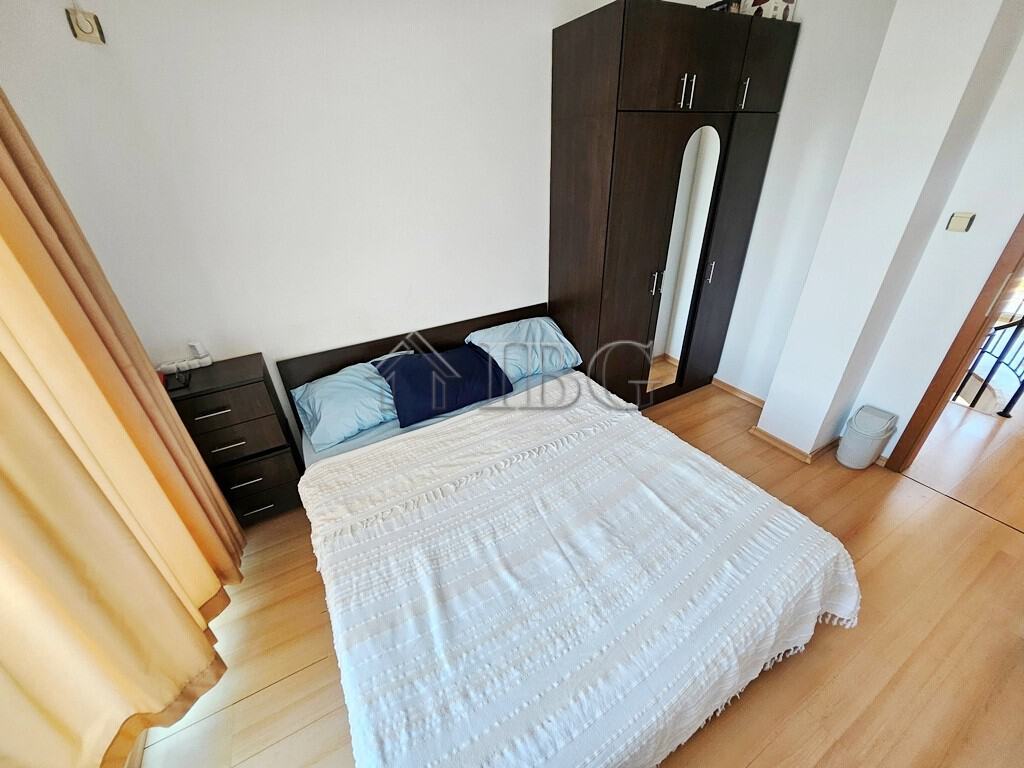 Bright bedroom with double bed and wardrobe in Sunny Day 3 complex.