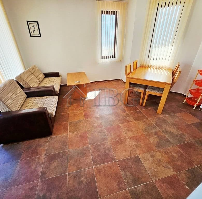 Apartment interior with living area and dining space in Bay View Villas, Sunny Beach.