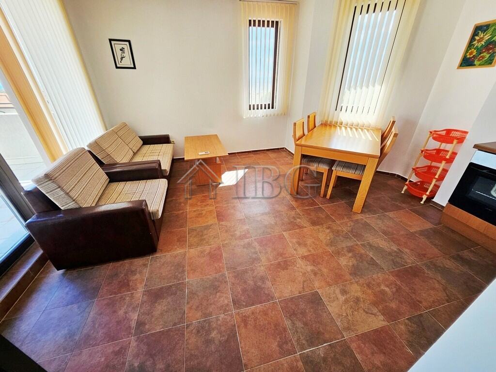 Apartment interior with living area and dining space in Bay View Villas, Sunny Beach.
