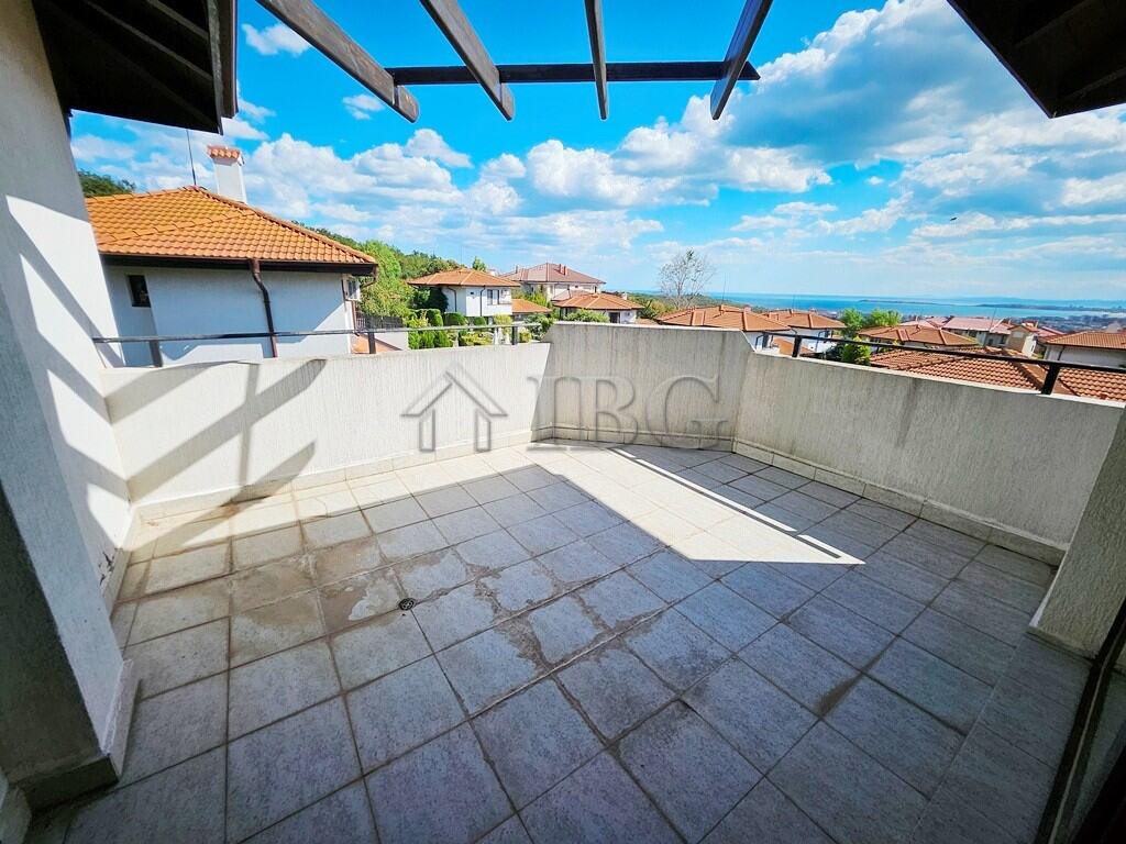 Balcony of a 1-bedroom apartment overlooking Sunny Beach and surrounding homes.