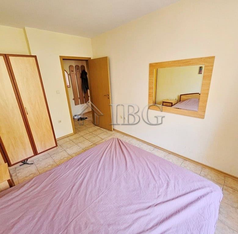 Spacious bedroom with pool view in Prestige City complex, Sunny Beach. Modern furnishings and bright.