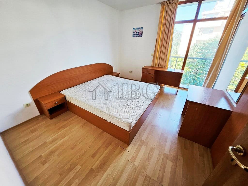 Cozy Bedroom with Pool View in Sunny Beach Bedroom with large window overlooking pool in Blue Summer Complex, Sunny Beach.