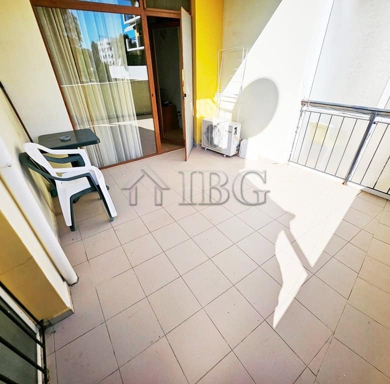 Bright balcony of a 1-bedroom apartment overlooking pool in Sunny Beach.