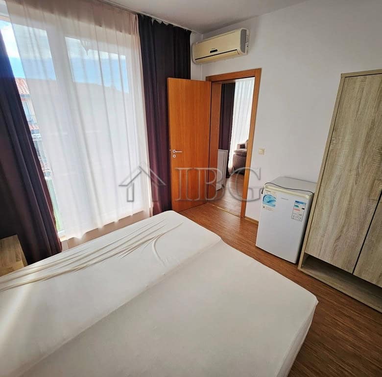 Spacious bedroom featuring a large window, wardrobe, and air conditioning in Sunny View Central, Sun.