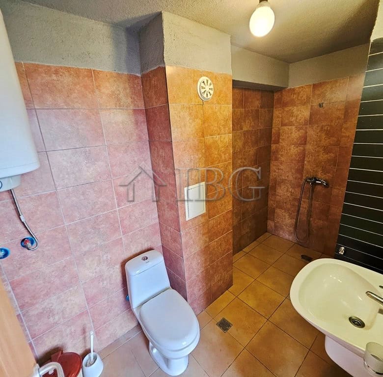 Bathroom with toilet and shower in Sunny View Central, Sunny Beach.