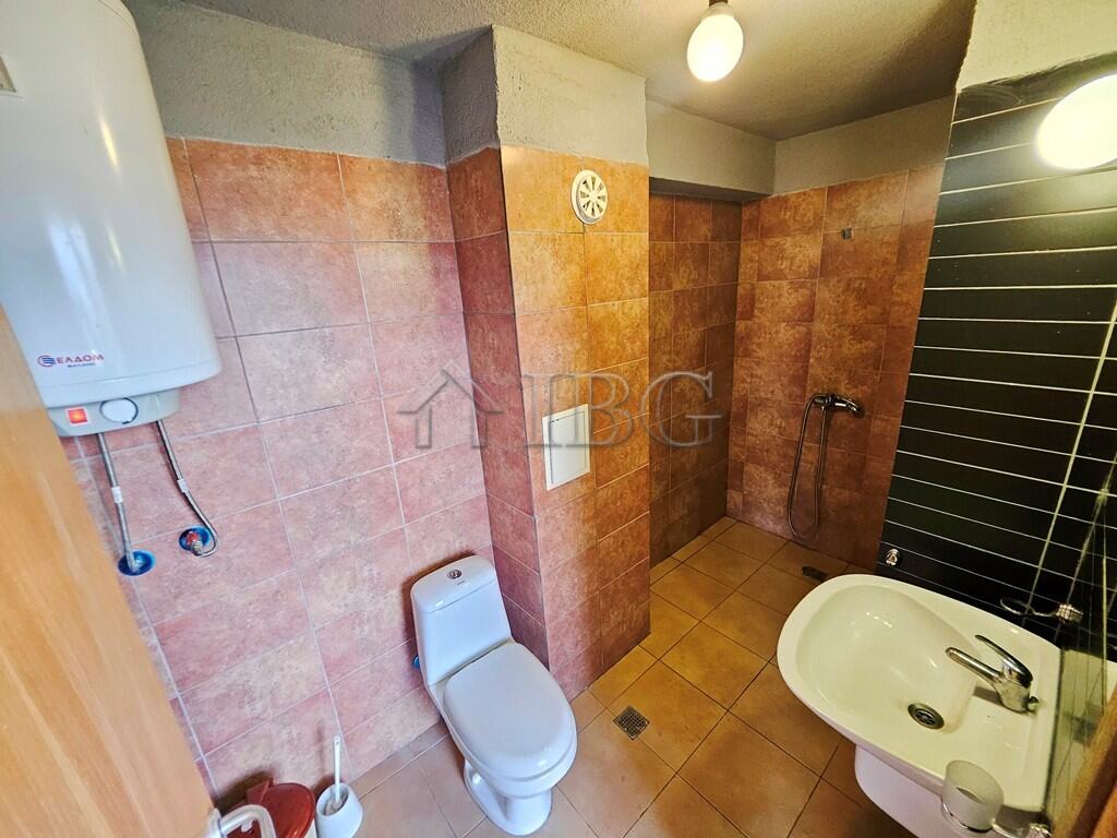 Bathroom with toilet and shower in Sunny View Central, Sunny Beach.