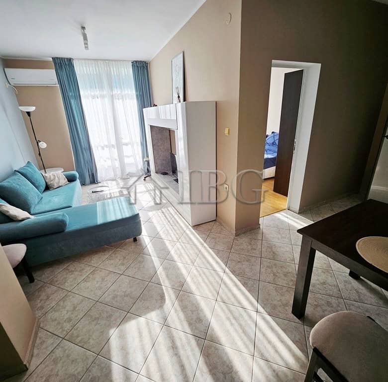 Bright living room with sofa and large windows in Pirop City, Sunny Beach.