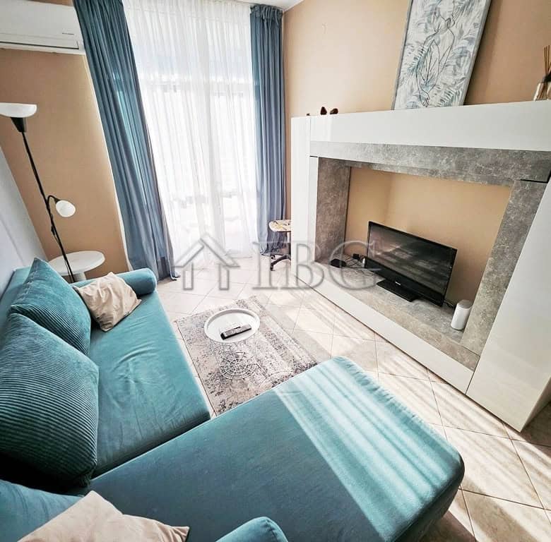 Bright 2-room apartment in Pirop City, Sunny Beach with modern furnishings and large windows.