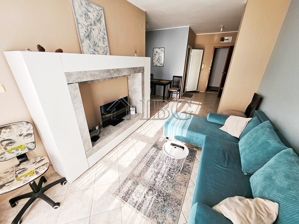 Modern 2-room apartment in Pirop City, Sunny Beach, Bulgaria. Bright living room with contemporary decor and a cozy sofa.