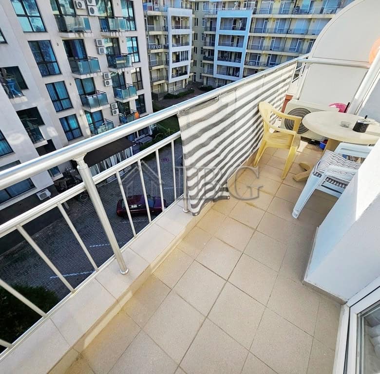 Balcony of a 2-room apartment in Pirop City, Sunny Beach, with outdoor seating and city views.