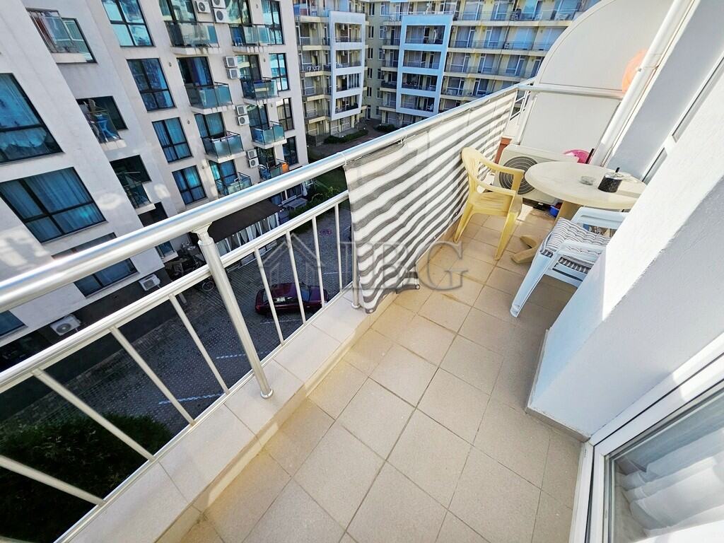 Modern 2-Room Apartment Balcony in Sunny Beach Balcony of a 2-room apartment in Pirop City, Sunny Beach, with outdoor seating and city views.
