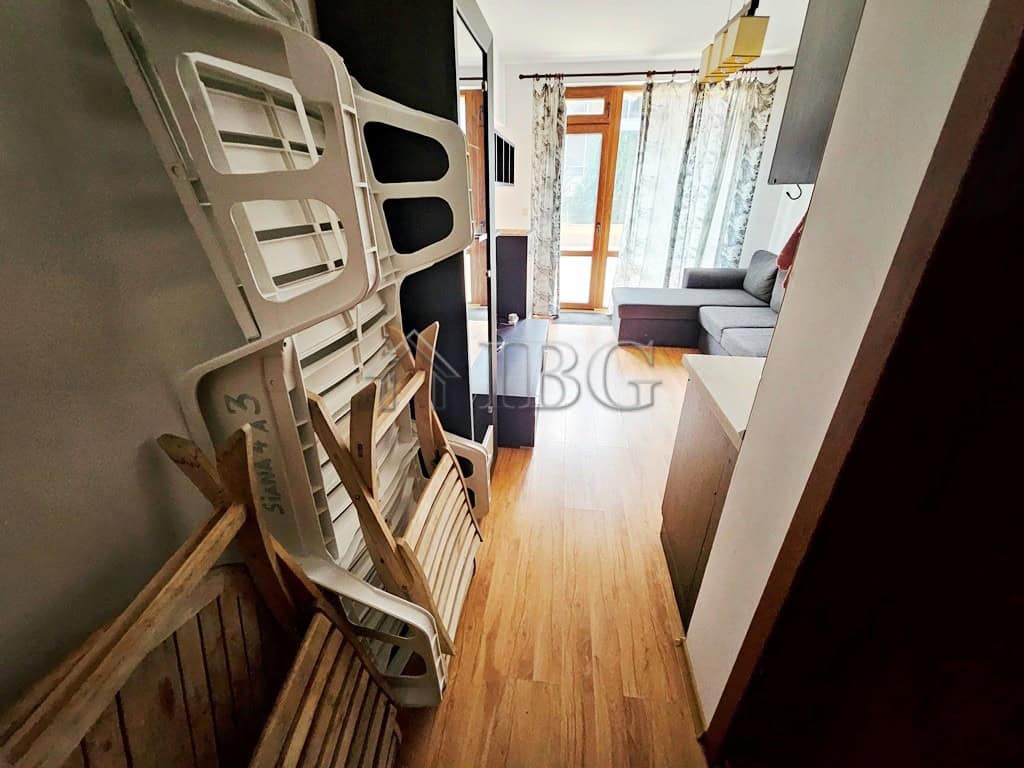 Bright living room with pool view and balcony in Sveti Vlas apartment.