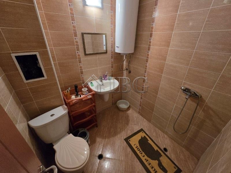 Bathroom with shower, toilet, and water heater in Elitonia 2, Ravda.