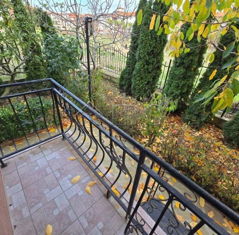 Balcony overlooking lush garden in Ravda, Bulgaria.