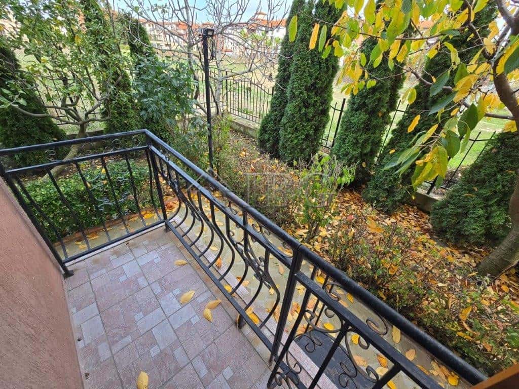 Balcony overlooking lush garden in Ravda, Bulgaria.