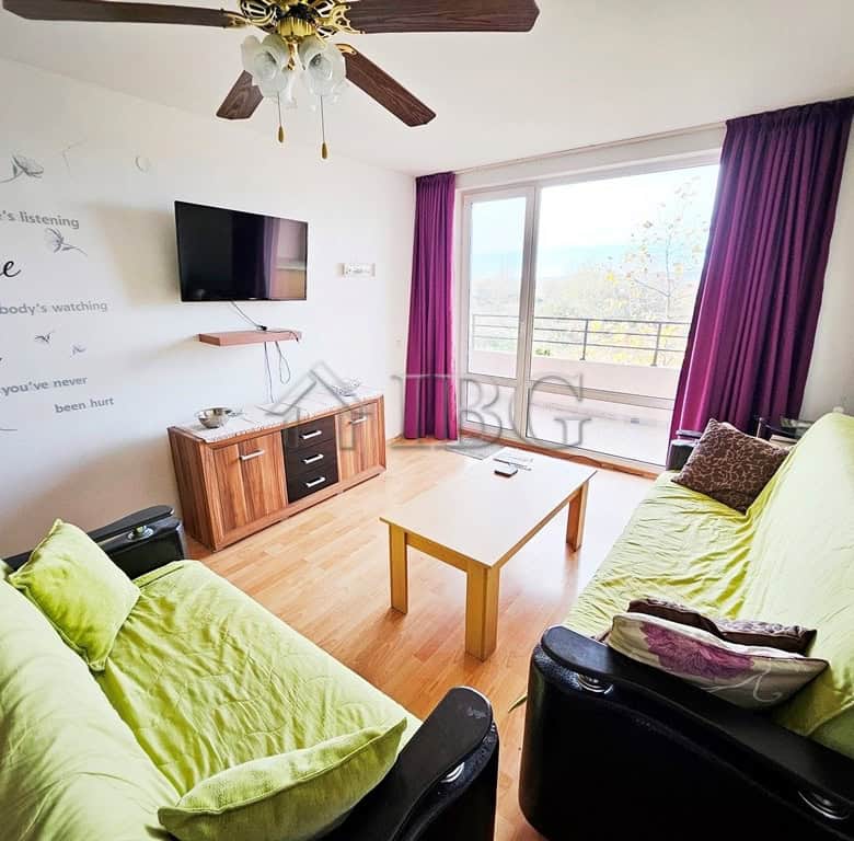 Bright living room with large balcony and scenic views in Sunny Beach.