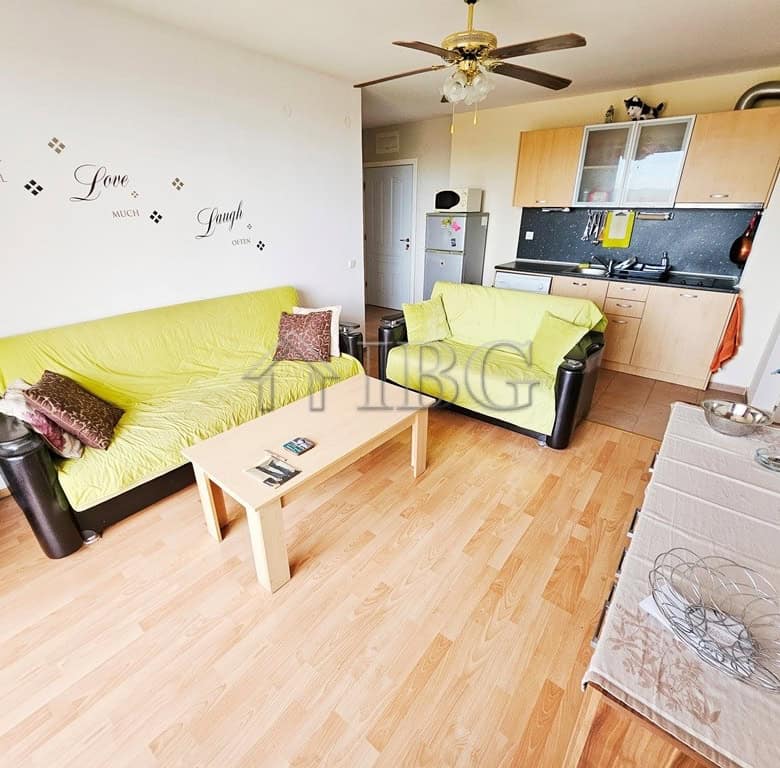 Bright living room with modern furniture and open kitchen in Sunny Beach.
