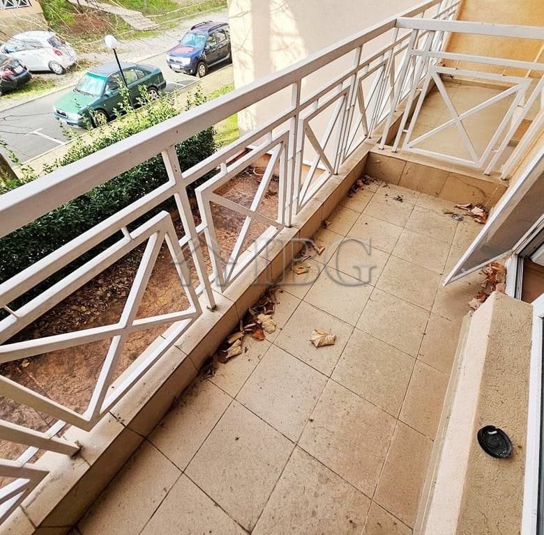 Balcony for sale with partial city views, ideal for relaxing or outdoor dining.