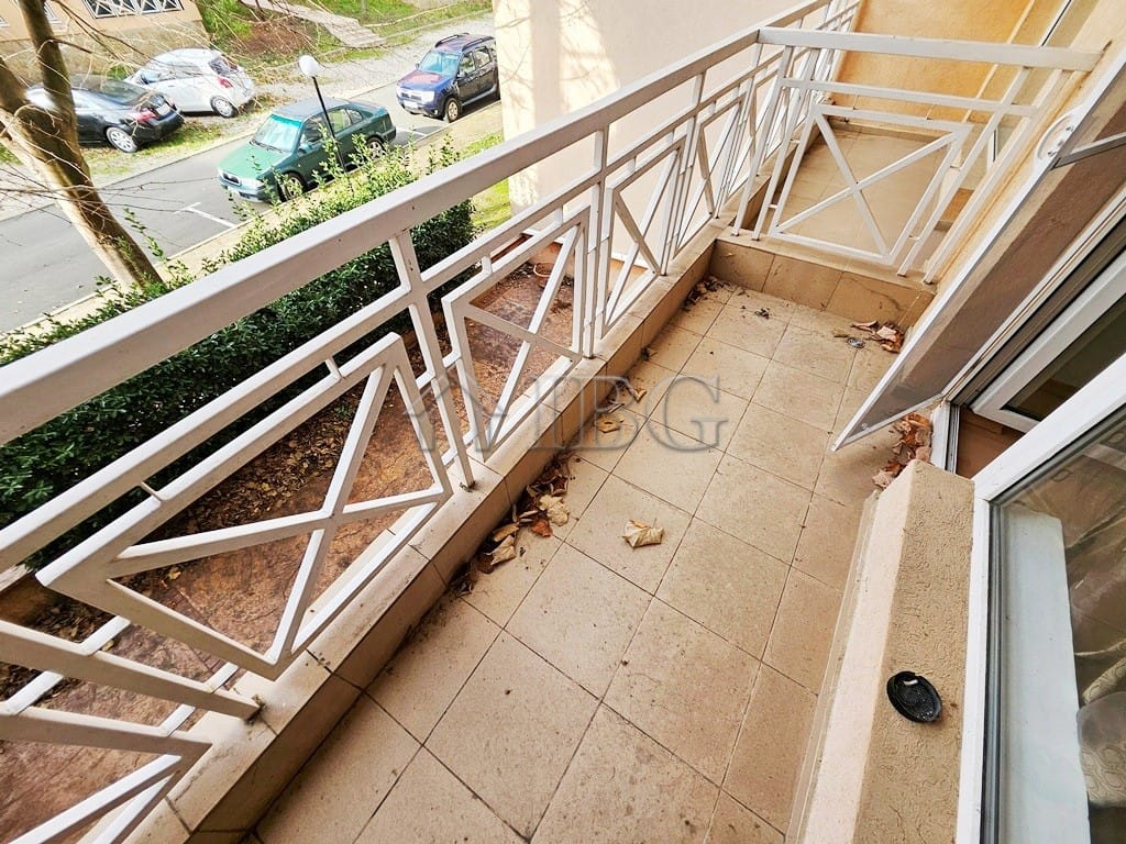 Balcony for sale with partial city views, ideal for relaxing or outdoor dining.