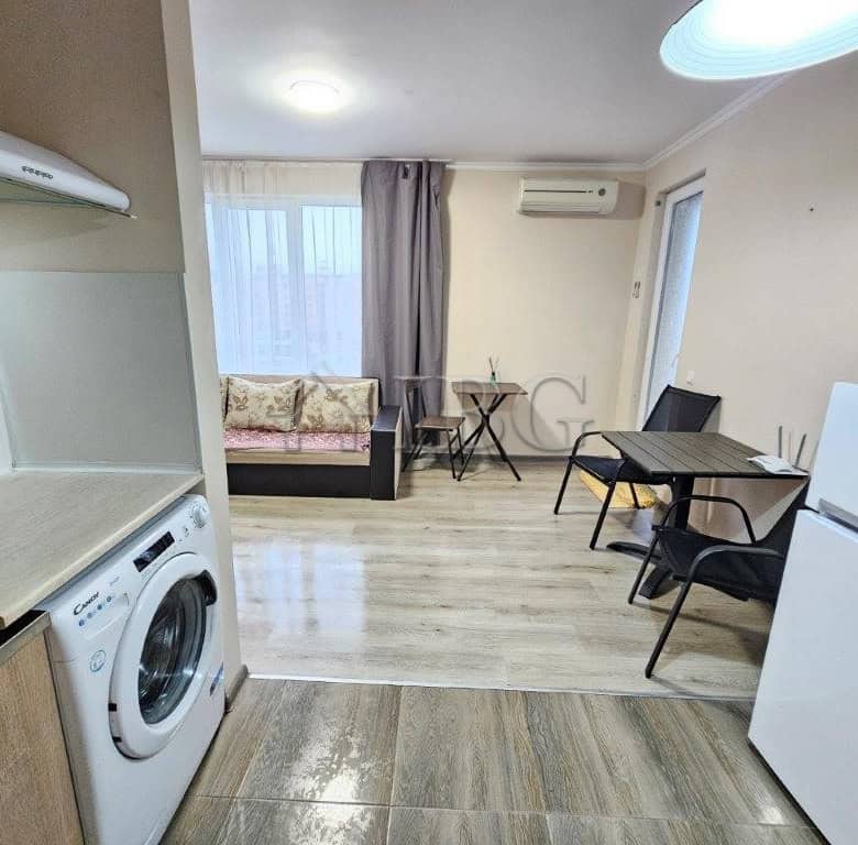 Cozy studio apartment for sale in Sunny Beach with kitchen, seating, and dining area.