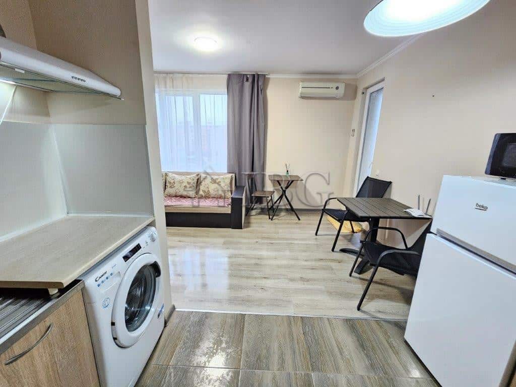 Cozy studio apartment for sale in Sunny Beach with kitchen, seating, and dining area.