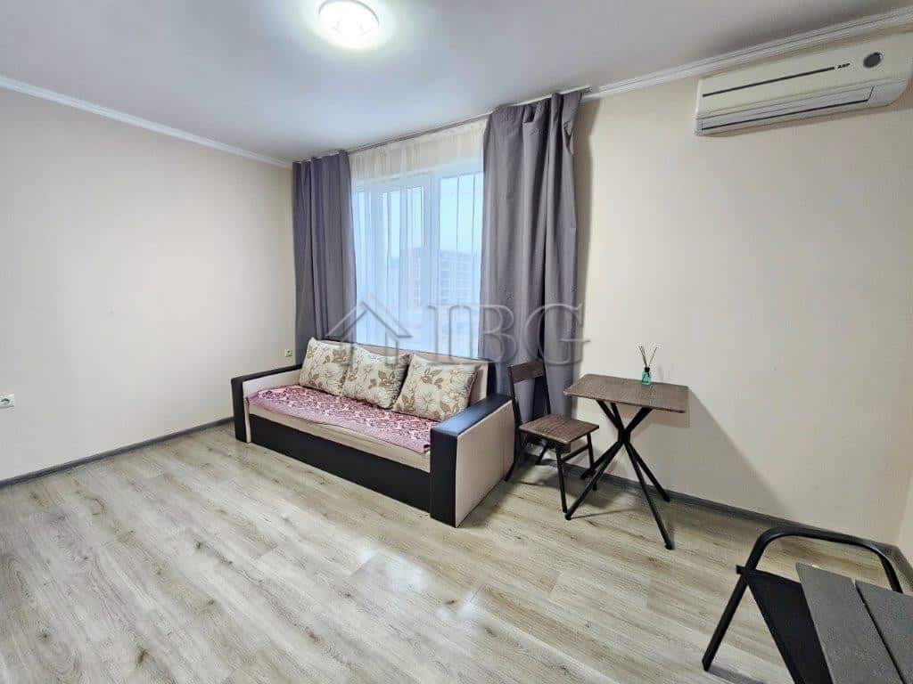 Bright studio apartment with a sofa, large window, and air conditioning in Sunny Beach. Perfect for.