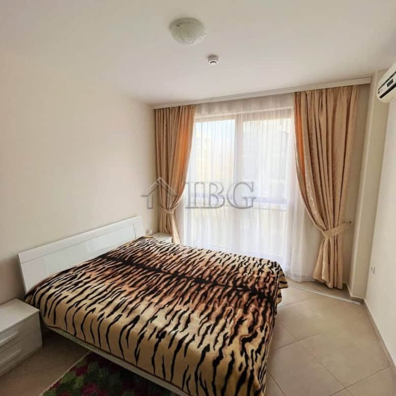 Furnished 1-bedroom apartment with tiger print bedding at Cascadas Family Resort, Sunny Beach.