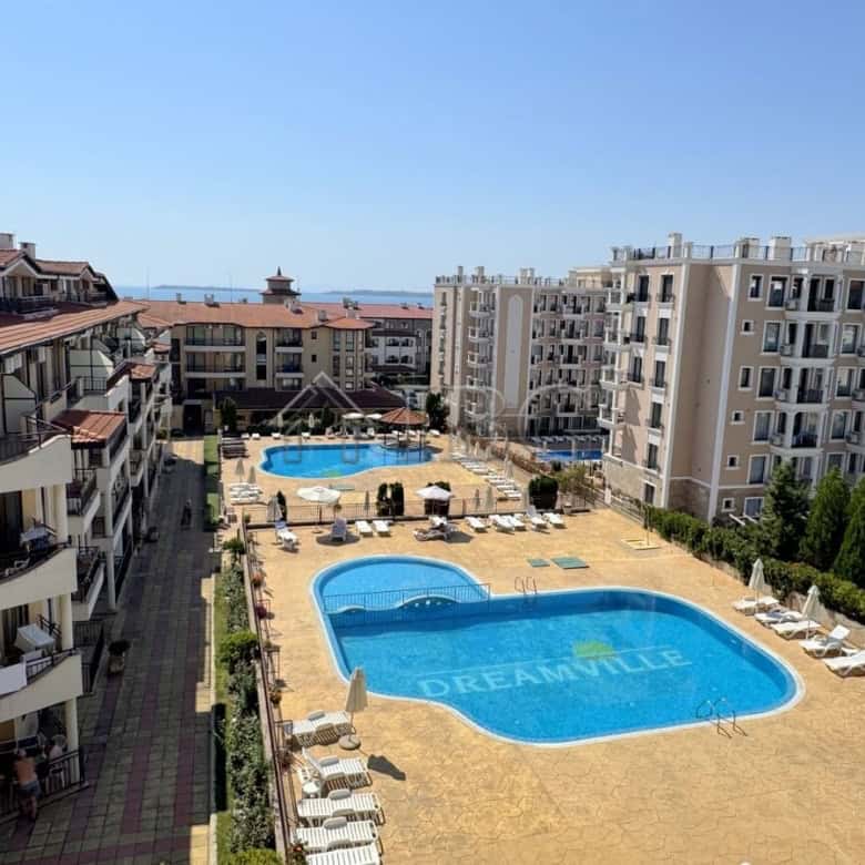 Modern 2-bedroom apartment in Sveti Vlas with access to a shared pool and balcony views of the surro.
