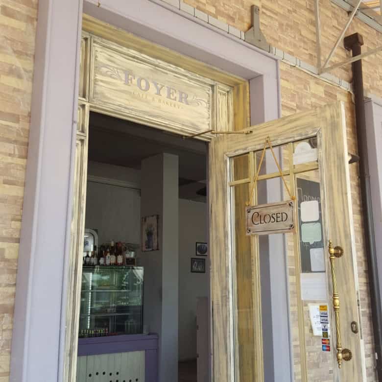 Entrance of an exclusive restaurant in Nessebar with a "Closed" sign on the door.