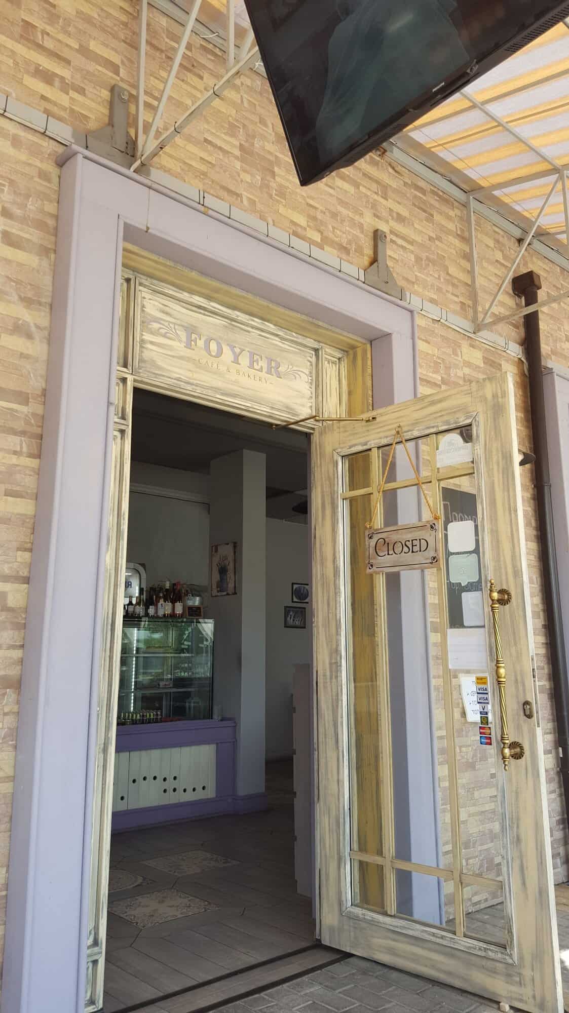 Entrance of an exclusive restaurant in Nessebar with a "Closed" sign on the door.