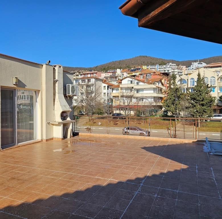 Spacious terrace with sea views in a Sveti Vlas complex, perfect for relaxing and enjoying the Dinev.