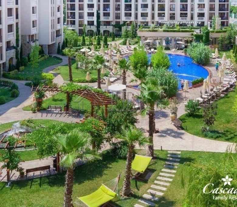 Modern garden with swimming pool and lush greenery at Cascadas Complex, Sunny Beach.