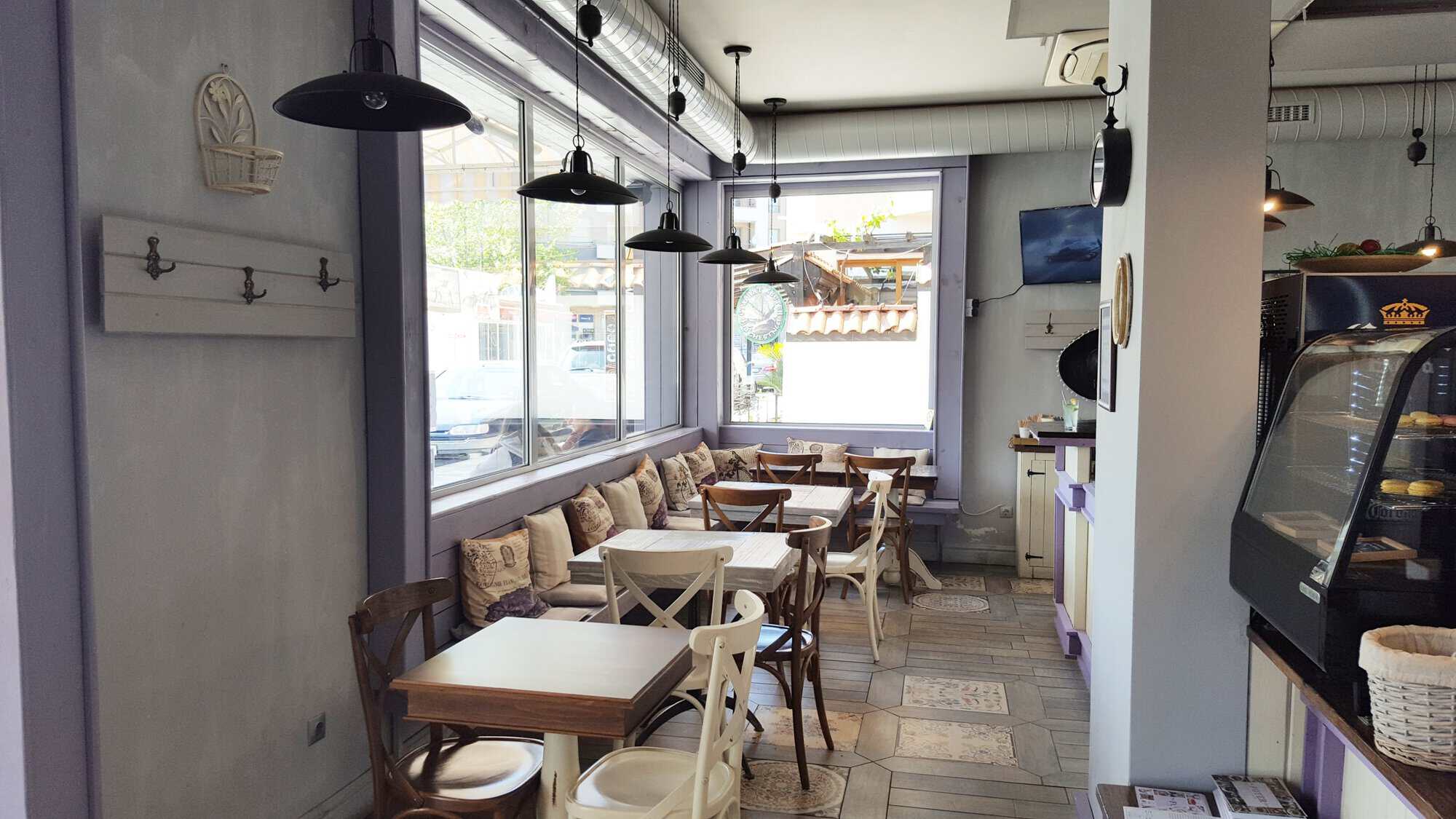 Interior view of an exclusive restaurant in Nessebar with wooden tables and comfortable seating.